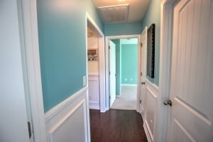 light blue hallway with wainscoting