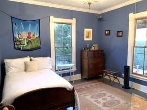 blue bedroom with white trim