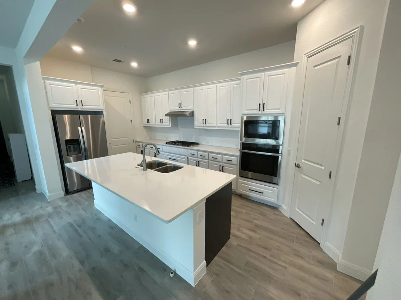 White painted kitchen cabinets and island