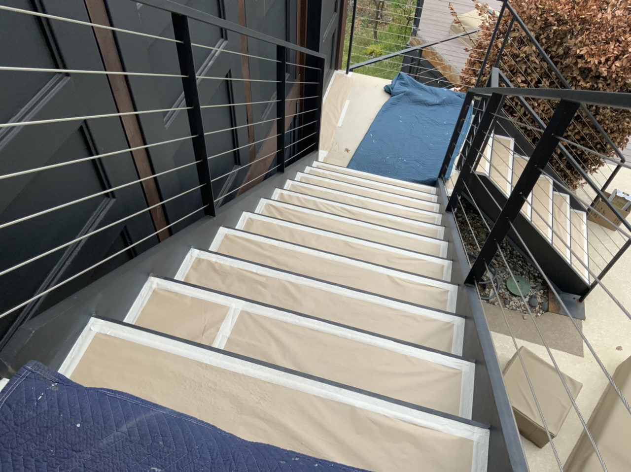 Masking stairs before painting railings and supports