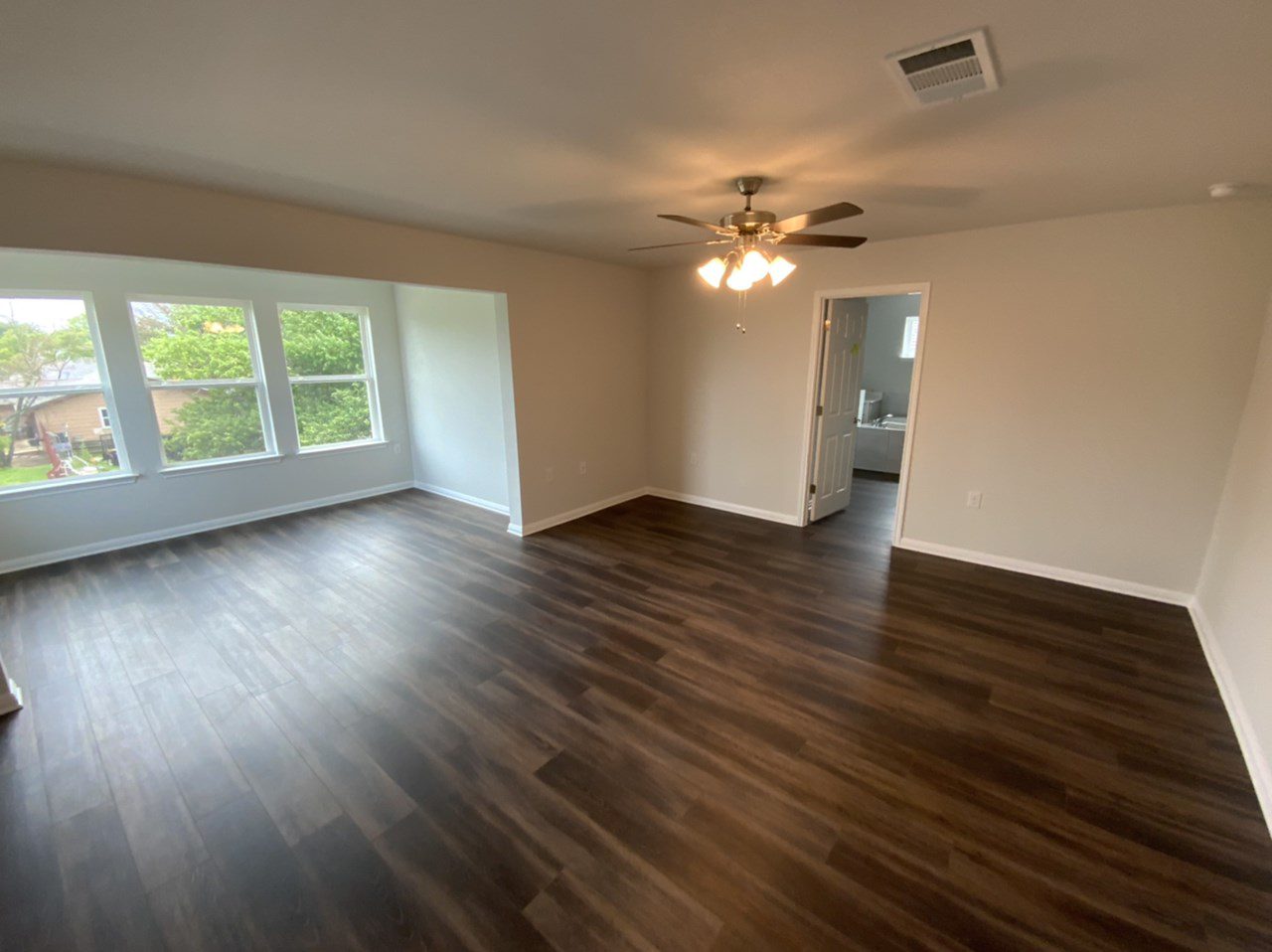 Master Bedroom – Before Painting Beige Walls with wood floor Master Bedroom - Before Painting Beige Walls with wood floor