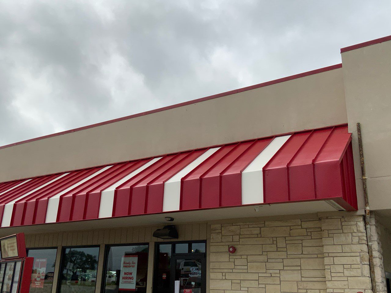 Repainted Red and White commercial metal awning