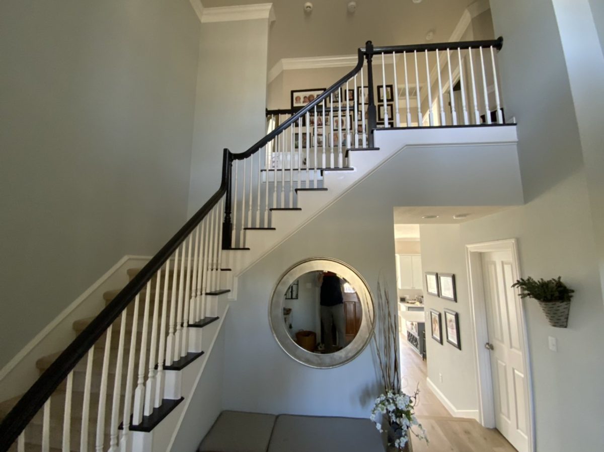 Stained stair railings with white painted balusters - SurePRO Painting