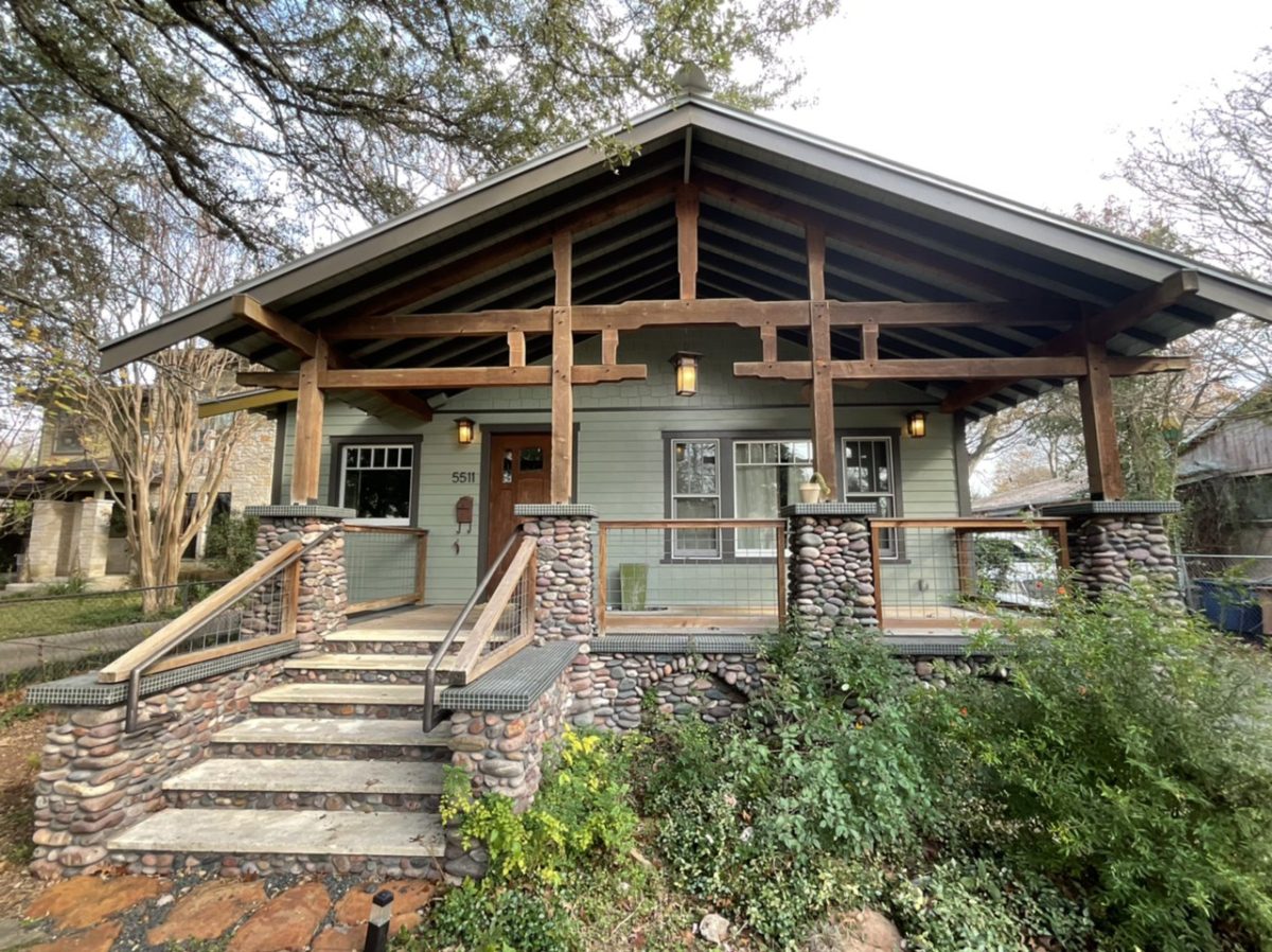 Green House Exterior with Dark Trim – SurePRO Painting