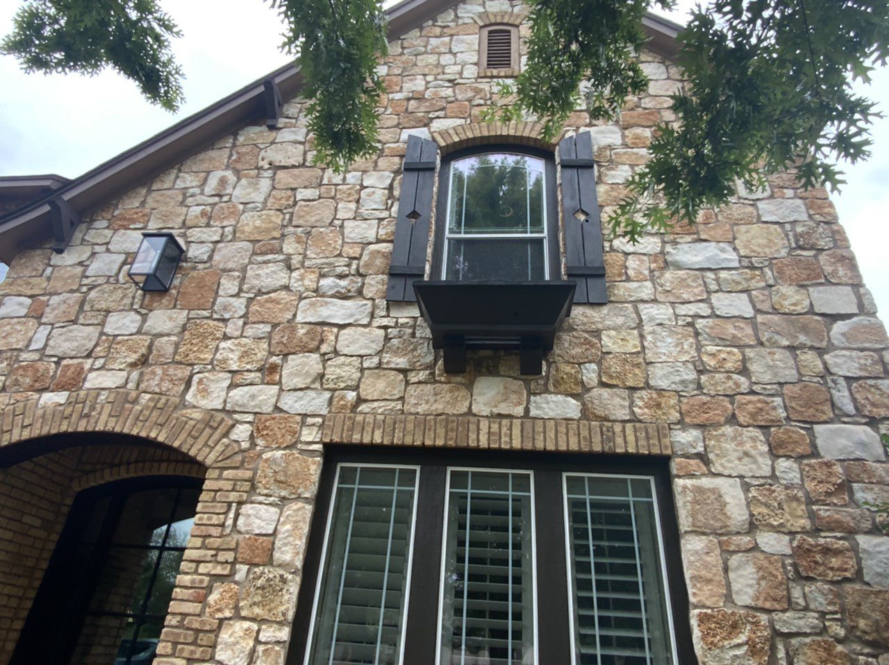 dark brown window shutters on stone house dark brown window shutters on stone house