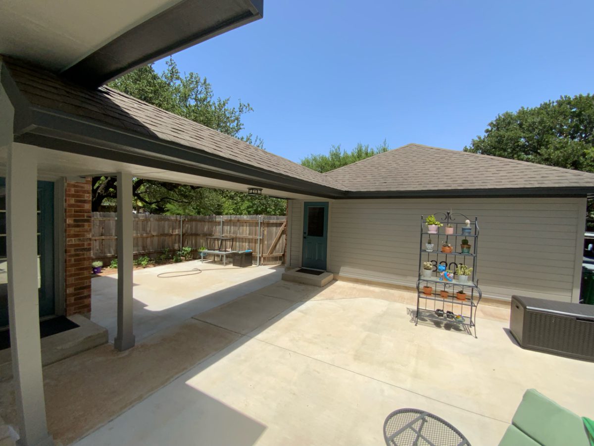 Gray paint with dark trim on patio cover and detached garage